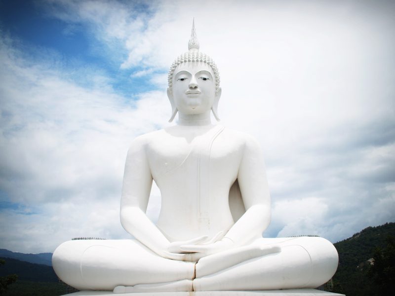 ancient white Gautama Buddha statue